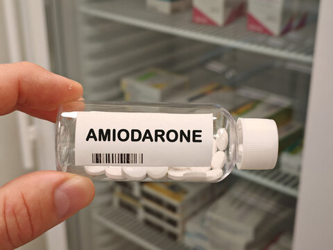 AMIODARONE antiarrhythmic for serious cardiac rhythm disorders bottle with tablets in pharmacy