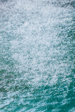 Close-up of a waterfall flowing into a forest pond