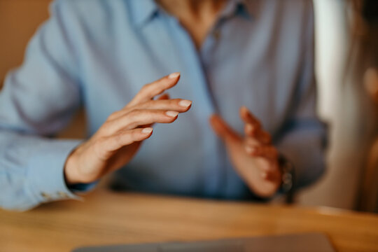 Businesswoman hands gesturing during professional explanation