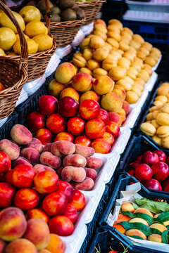 Fresh fruits and berries on display at a vibrant farmers market