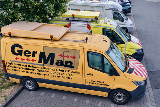 Special transport escort vans for heavy loads logistics and infrastructure services in Handewitt Germany road safety warning lights Schleswig Holstein