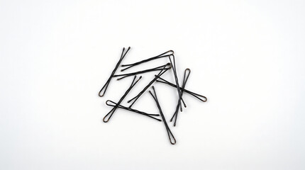 Obraz premium Black Bobby Pins Isolated on White Background
