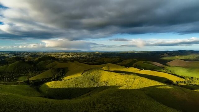 Rolling hills timelapse cloud shadows drift across slopes light shifting gradually view