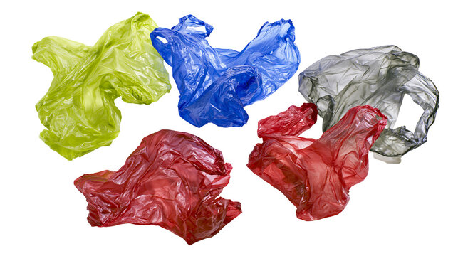 Crinkled plastic shopping bags in red blue green, and gray