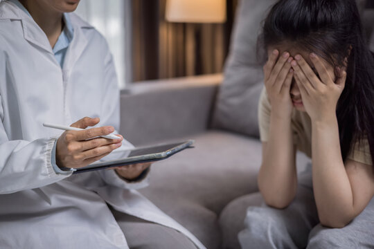 Caring caregiver comforting a patient with depression while documenting daily symptoms, mental health support, therapy, counseling, recovery, healthcare, emotional wellness, hope.