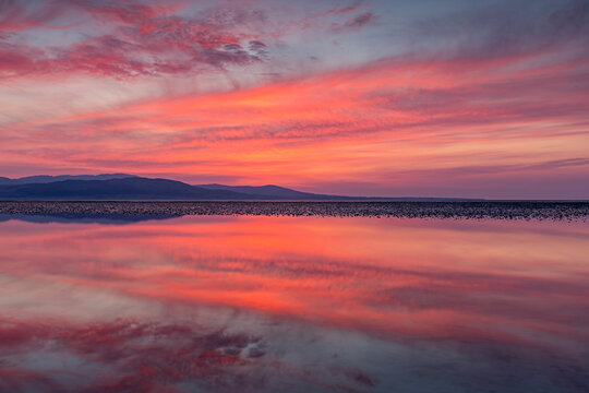 Stunning sunrise with cloud reflections over Dundalk Bay, Louth Ireland