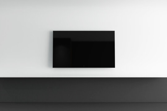 Modern Smart TV Mockup onminimalist white and black Wall Interior. 24