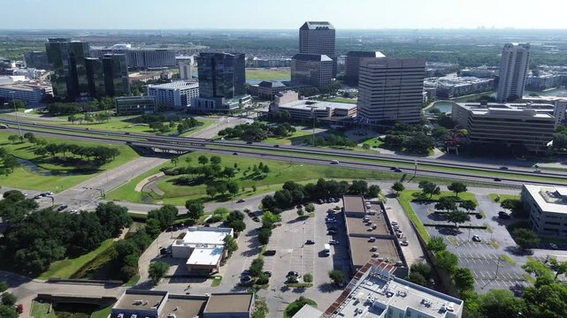 Tall glass facades rise above professional office complexes situated along primary traffic arteries. Prime corporate real estate assets characterize vibrant Las Colinas, Irving, North Texas