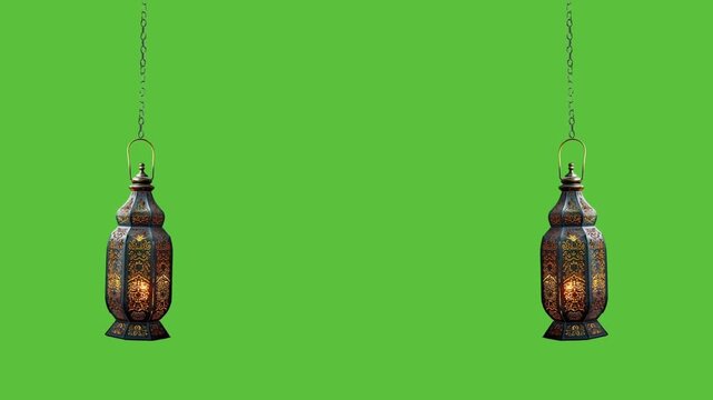  Two traditional arabic lanterns swinging on chains with glowing light inside on a green screen background