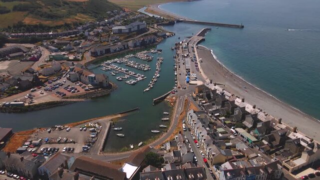 Aberystwyth harbor marina pier breakwater and pebble beach aerial view