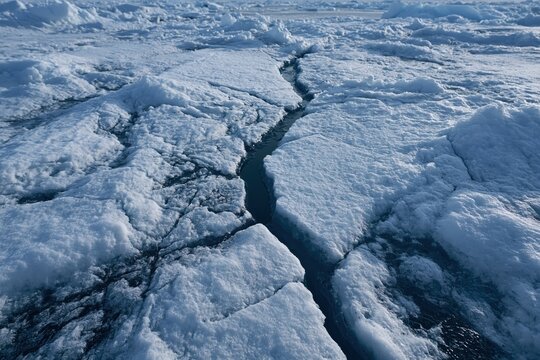 Arctic ice expanding cracks indicating global warming