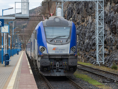 Szklarska Poreba, Poland - December 21, 2025: A blue PKP Intercity electric train pulls into a scenic mountain station platform to highlight modern rail travel infrastructure
