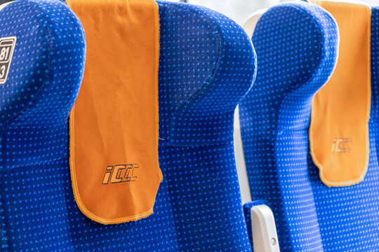 Szklarska Poreba, Poland - December 21, 2025: PKP Intercity blue train seats with orange headrest covers in a modern passenger carriage for comfortable long distance travel