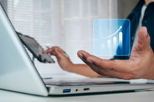 Business professional presenting digital revenue growth dashboard with upward trend chart on laptop for business performance, sales growth, profit optimization, financial forecasting, growth strategy