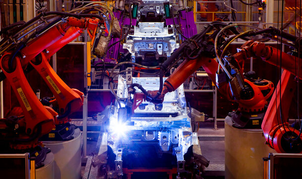 Automated production line with robotic arms in automobile manufacturing plants