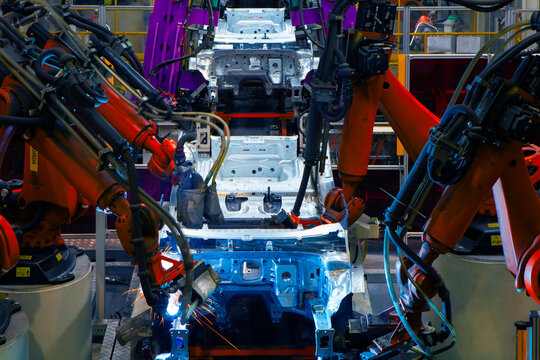 Automated production line with robotic arms in automobile manufacturing plants