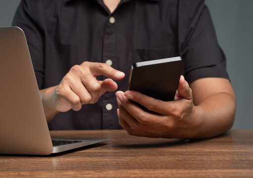 Using Smartphone Beside Laptop at Office Desk