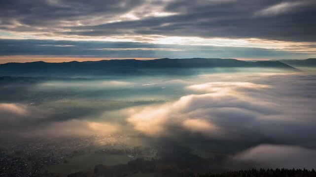 Cloud fog timelapse layers shifting continuously sunlight piercing through atmospheric scene