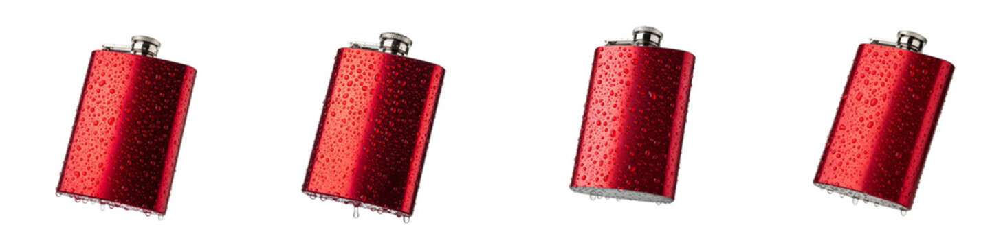 Red metal hip flasks with water droplets isolated on black background