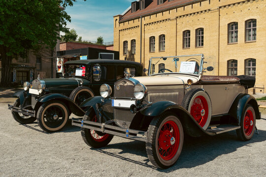 Ford Model A Phaeton and Vintage Sedan at Berlin Car Exhibition