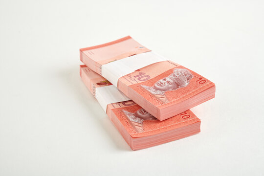 Stack of Malaysian Ten Ringgit Banknotes on White Background