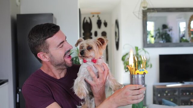 Man celebrating his dog&acute;s birthday