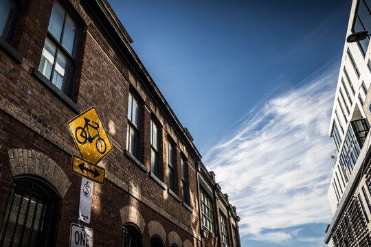 Historic Brick Building with Modern Architecture and Bicycle Signage in Fitzroy Melbourne