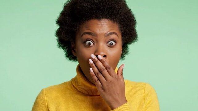 Surprised Expression of a Young Woman with Natural Hair in a Yellow Turtleneck Sweater Against a Soft Green Background Captured in Two Distinct Frames