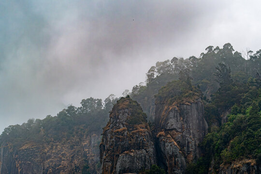 Pillar rocks in fog at Kodaikanal, Kerala, india