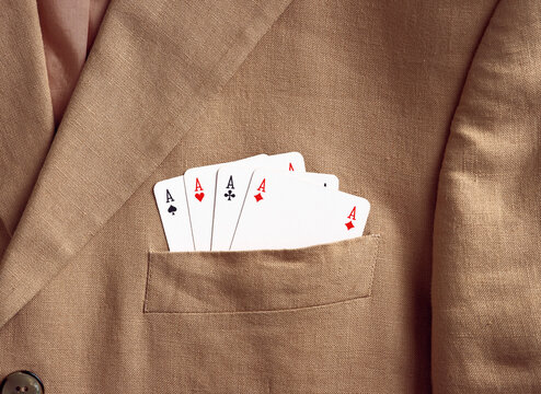 Aces showing in a suit jacket pocket
