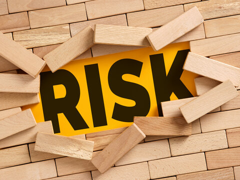 Wooden blocks revealing the concept of risk