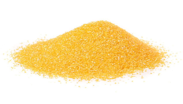 Yellow Corn Meal Grains Pile Isolated on White Background for Cooking and Food Preparation