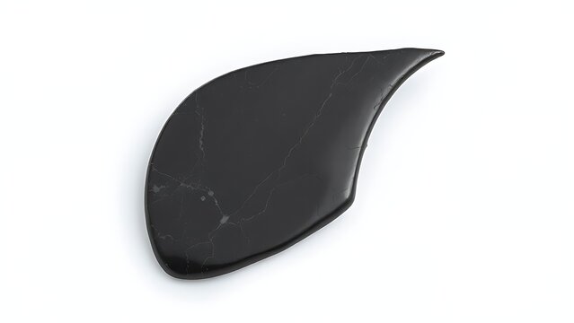 Curved black flint stone resembling a pteranodon crest, isolated on light background.