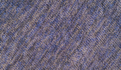 Close-up of blue and gray knitted fabric texture with detailed woven pattern, suitable as a textile background or abstract material surface. © eza