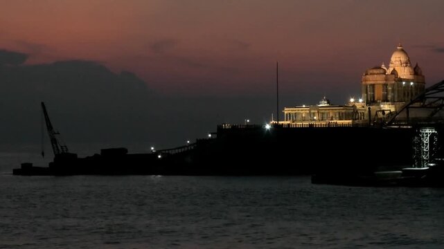The early morning view of illuminated Vivekananda Rock Memorial and nearby structures from the mainland | Kanyakumari, Tamil Nadu, India