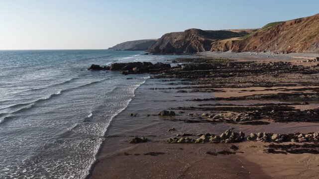 incoming tide on Sandymouth Bay beach Cornwall