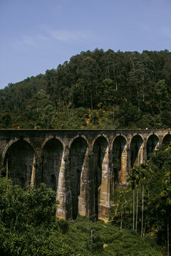 Historic Nine Arch Bridge surrounded by tropical forest in Ella