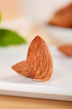 Fresh Raw Almonds on White Plate - Healthy Natural Nuts Snack Food Photography