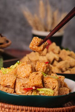 Traditional Chinese Fried Tofu Cubes with Chopsticks and Vegetables Asian Cuisine