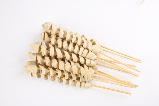 Henan Dry Gluten Skewers Homemade Chinese Vegetarian Food on Wooden Sticks White Background