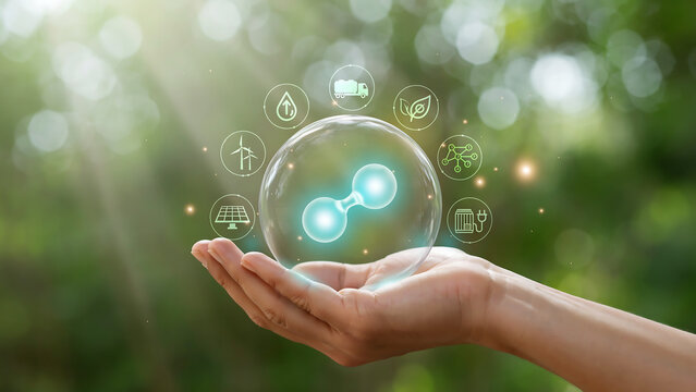 Hand holding a glowing hydrogen molecule in a crystal ball with renewable energy and sustainability icons