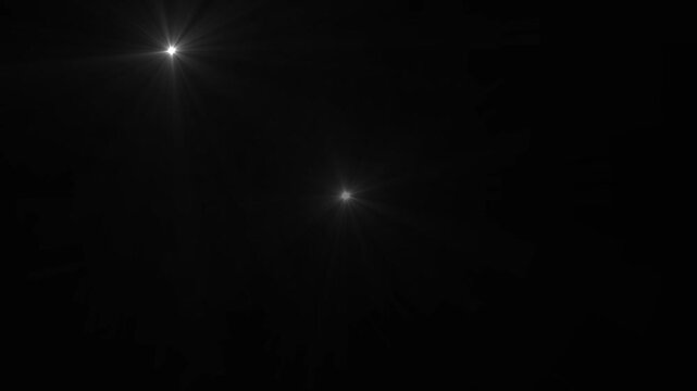 Camera flashes Lights black background. white camera flashes random black screen.Flashing lens flares.
 Seamless looping.loopable motion graphic video.Camera Flashes at a stadium concert.