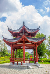 Obraz premium Chinese Red Pavilion in Guigang Garden with Curved Eaves