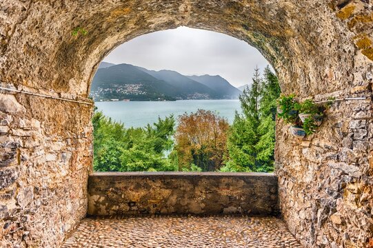 Picturesque Lake Como View Through an Ancient Stone Archway