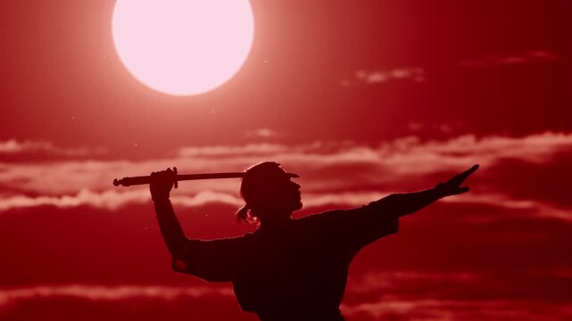 Sunset sword practice by a martial artist on the beach