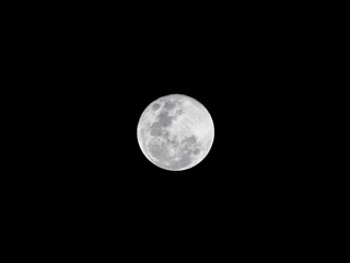 Obraz premium Super Full Moon Isolated on Pitch Black Sky