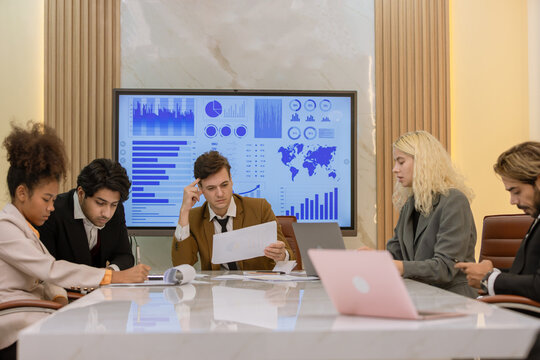 Diverse colleagues gather in brainstorm discuss statistics together. Group of people colleagues gather doing Brainstorming business plan together. Team Brainstorm Working Concept.