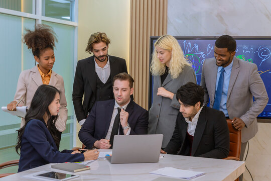 Diverse colleagues gather in brainstorm discuss statistics together. Group of people colleagues gather doing Brainstorming business plan together. Team Brainstorm Working Concept.