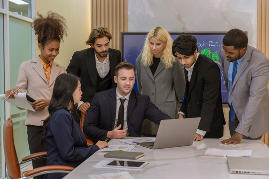 Diverse colleagues gather in brainstorm discuss statistics together. Group of people colleagues gather doing Brainstorming business plan together. Team Brainstorm Working Concept.