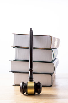 Judge gavel and law books on desk symbolizing justice and legal authority